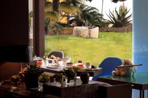 a table with a teddy bear sitting on top of it at Park Hotel in Desenzano del Garda