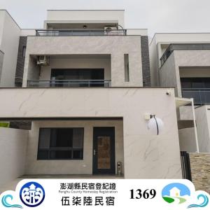 a house for sale in korea with a building at 576親子民宿 in Hou-liao
