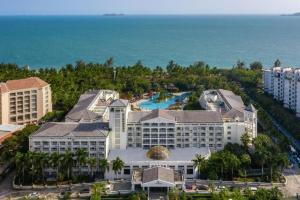 an aerial view of the resort with the ocean in the background at Sanya Summer Beach Sea View Hotel in Sanya