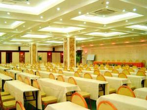 an empty banquet hall with tables and chairs at Sanya Summer Beach Sea View Hotel in Sanya +245 photos