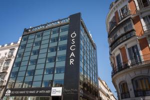a building with a sign on the side of it at Room Mate Oscar, Madrid in Madrid