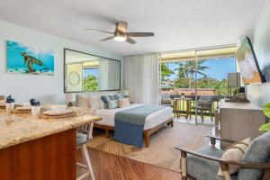 a bedroom with a bed and a living room at Napili Ridge G16 · NR G16 Updated Napili Condo Walk to Napili Ba in Kahana