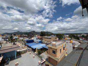 an overhead view of a city with buildings at Reva suites in Arsikere
