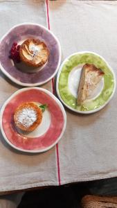 three plates of food sitting on a table at Museo Grillo Camere d'Arte, dormire nel Museo in Arena Po