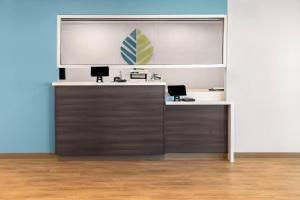 an office with a desk with two chairs at WoodSpring Suites Greenville Airport in Greenville
