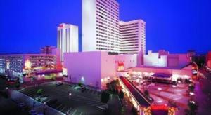 a city at night with tall buildings and street lights at Harrahs Hotel Reno in Reno