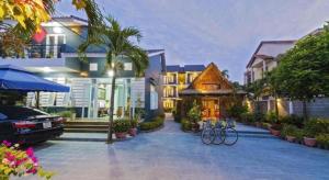 a house with bikes parked in front of it at Friendly Villa Hoian in Hoi An