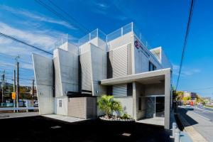 a large building with at BOND COMFORT HOTEL MIYAJIMAGUCHI - Vacation STAY 79234v in Hatsukaichi