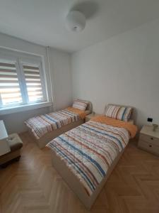 Ένα ή περισσότερα κρεβάτια σε δωμάτιο στο Angela Modern Apartment