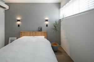 Ένα ή περισσότερα κρεβάτια σε δωμάτιο στο 暁の宿