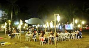 a group of people sitting at tables at night at Subic Park Hotel in Olongapo +155 photos