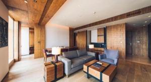 a living room with a couch and a table at AOLUGUYA in Harbin