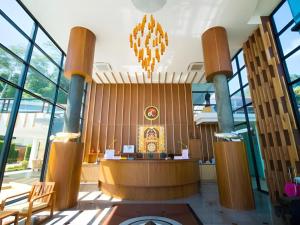a lobby of a building with a podium in it at Phi Phi Nice Beach Hotel Hip in Phi Phi Don +265 photos