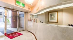 a lobby of a store with a red rug at Hotel Starplaza Ikebukuro in Tokyo