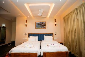 Postel nebo postele na pokoji v ubytování Khamsum Phuntsholing