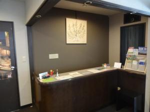 an office with a desk with a picture on the wall at Kusatsu onsen Futabaya in Kusatsu +23 photos