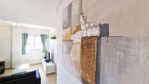 a living room with a wall covered in plaster at Spacious Ground Floor Apartment, Free WiFi, Patio, AC in Sucina
