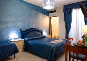 Ένα ή περισσότερα κρεβάτια σε δωμάτιο στο Spartacus