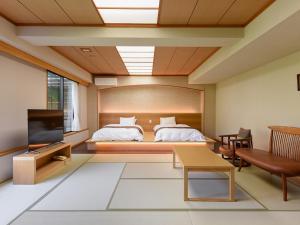 Ένα ή περισσότερα κρεβάτια σε δωμάτιο στο 萩城三の丸 北門屋敷