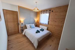 Ένα ή περισσότερα κρεβάτια σε δωμάτιο στο Modern apartment in the heart of Chinaillon +17 φωτογραφίες