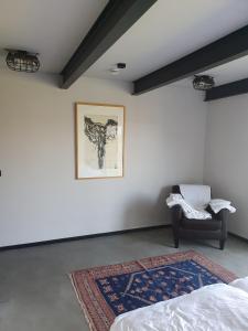 a room with a bed and a picture on the wall at LOFT in Ribbeck in Nauen +19 photos