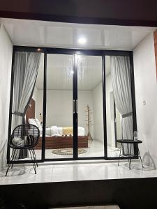 Ένα ή περισσότερα κρεβάτια σε δωμάτιο στο Batur Jemsokin Logement