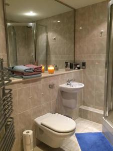 a bathroom with a toilet and a sink at A double room in a great location in Southampton +30 photos