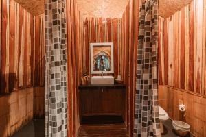 a wooden bathroom with a sink and a mirror at Khaosok Boutique Camps in Ban Bang Thong +88 photos