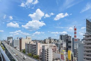 a view of a city with cars on a highway at Apartment Hotel 11 Nagoya Sakae in Nagoya