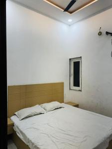 En eller flere senge i et værelse på Hotel Green Valley