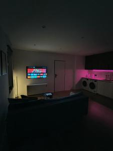 a living room with a couch and a tv at #22, Free parking, Self check-in, Perfect location for Katowice, Chorzow, and DTS, 3rd floor - no elevator in Chorzów +13 photos