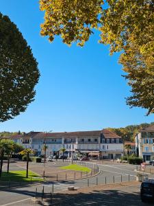 a street in front of a building with a parking lot at Villa Milady in Salies-du-Salat +78 photos