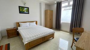 Postel nebo postele na pokoji v ubytování Oceanic Hotel Vung Tau + 5 fotografií