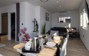 a dining room and living room with a table and chairs at Villa Klara - Makarska by Villas Guide in Vrgorac