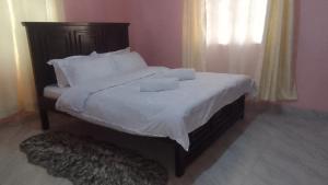 Ένα ή περισσότερα κρεβάτια σε δωμάτιο στο Style & comfort homes