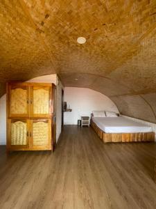 a bedroom with a bed and a wooden floor at Annapurna Nature Retreat, Namchi South Sikkim in Singtām +40 photos