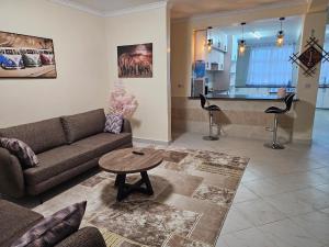 a living room with a couch and a table at Pofu Stay Eldoret in Eldoret