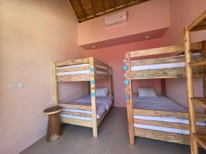 a room with two bunk beds in a house at Bali Dream Beach House - Family Friendly Villa in the Heart of Sanur Beach, Cafes, Market & Shopping in Sanur