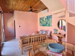 a living room with a couch and a table at Bali Dream Beach House - Family Friendly Villa in the Heart of Sanur Beach, Cafes, Market & Shopping in Sanur