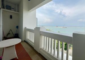 a balcony with a view of the ocean at Straits Quay Seaview in Tanjung Bungah