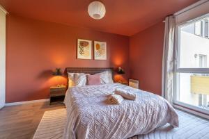 a bedroom with a bed with a teddy bear on it at Heaven Loft - proche RER A - DISNEY LAND in Bussy-Saint-Georges