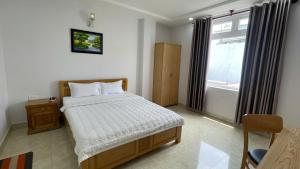 Postel nebo postele na pokoji v ubytování Oceanic Hotel Vung Tau