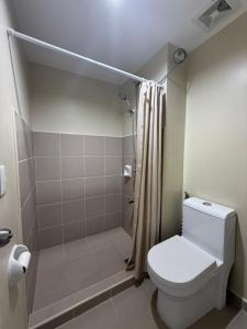 a bathroom with a toilet and a shower at Condo in Cagayan de Oro City in Cagayan de Oro +16 photos