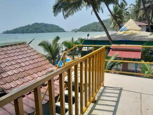 a view of the beach from the balcony of a resort at Brendons Goa in Palolem