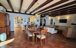 a kitchen and dining room with a table and chairs at Villa Palazzo del mar Opatija by Villas Guide in Mošćenička Draga