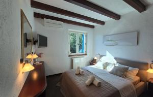 a bedroom with a bed with two towels on it at Villa Palazzo del mar Opatija by Villas Guide in Mošćenička Draga +69 photos