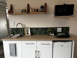 Kuchyň nebo kuchyňský kout v ubytování Wil-Bloom