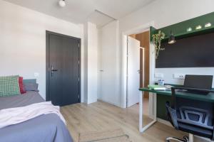 TV a/nebo společenská místnost v ubytování Residencia Universitaria Resa Campo Grande