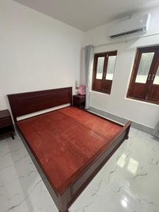 Katil atau katil-katil dalam bilik di Myluangprabangguesthoues