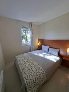 Ένα ή περισσότερα κρεβάτια σε δωμάτιο στο Cottage Rubens 11 2chambres calme
